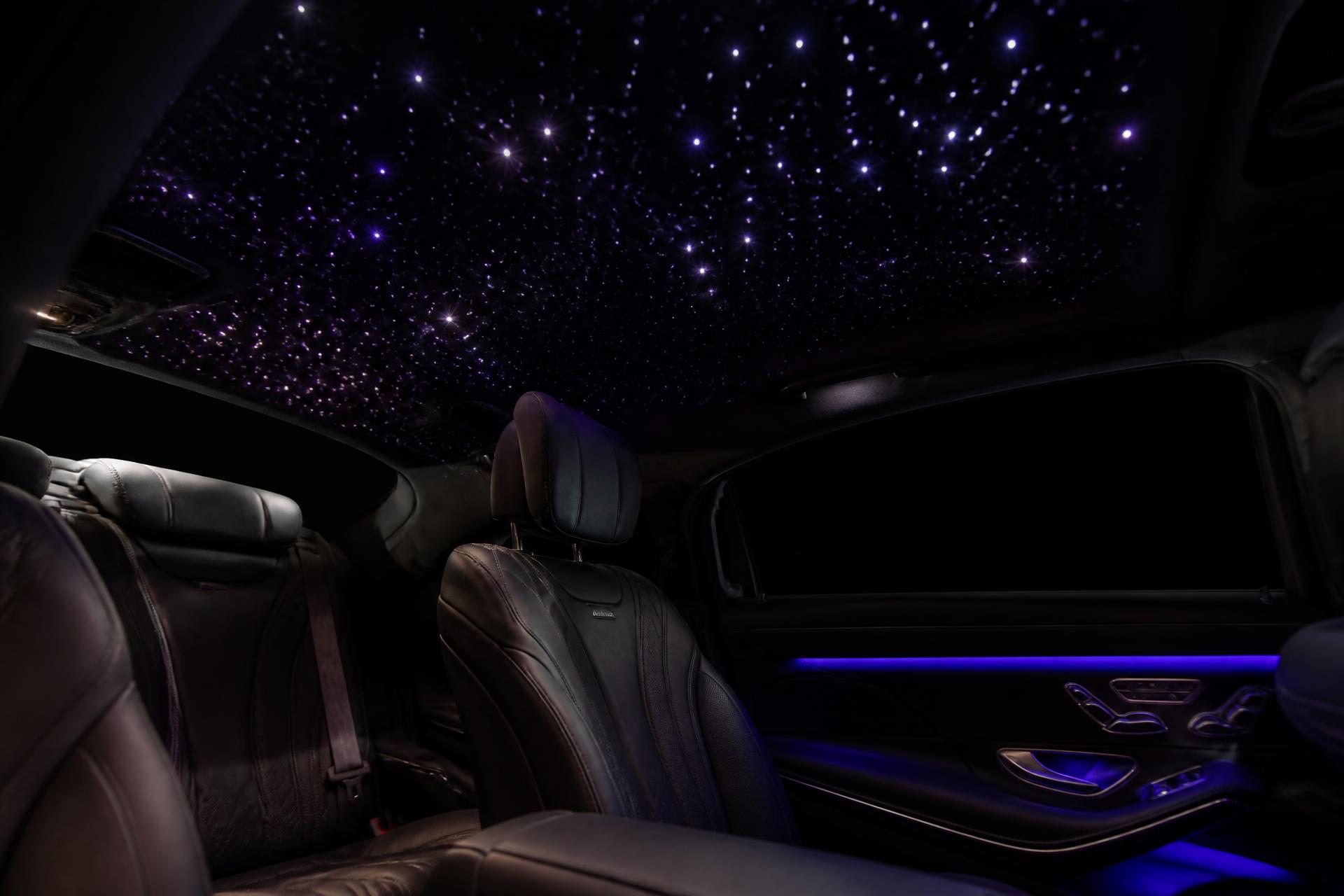 Luxury car interior with a fiber-optic starlight headliner